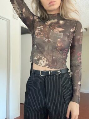 Disturbia Sheer Printed top
Size S